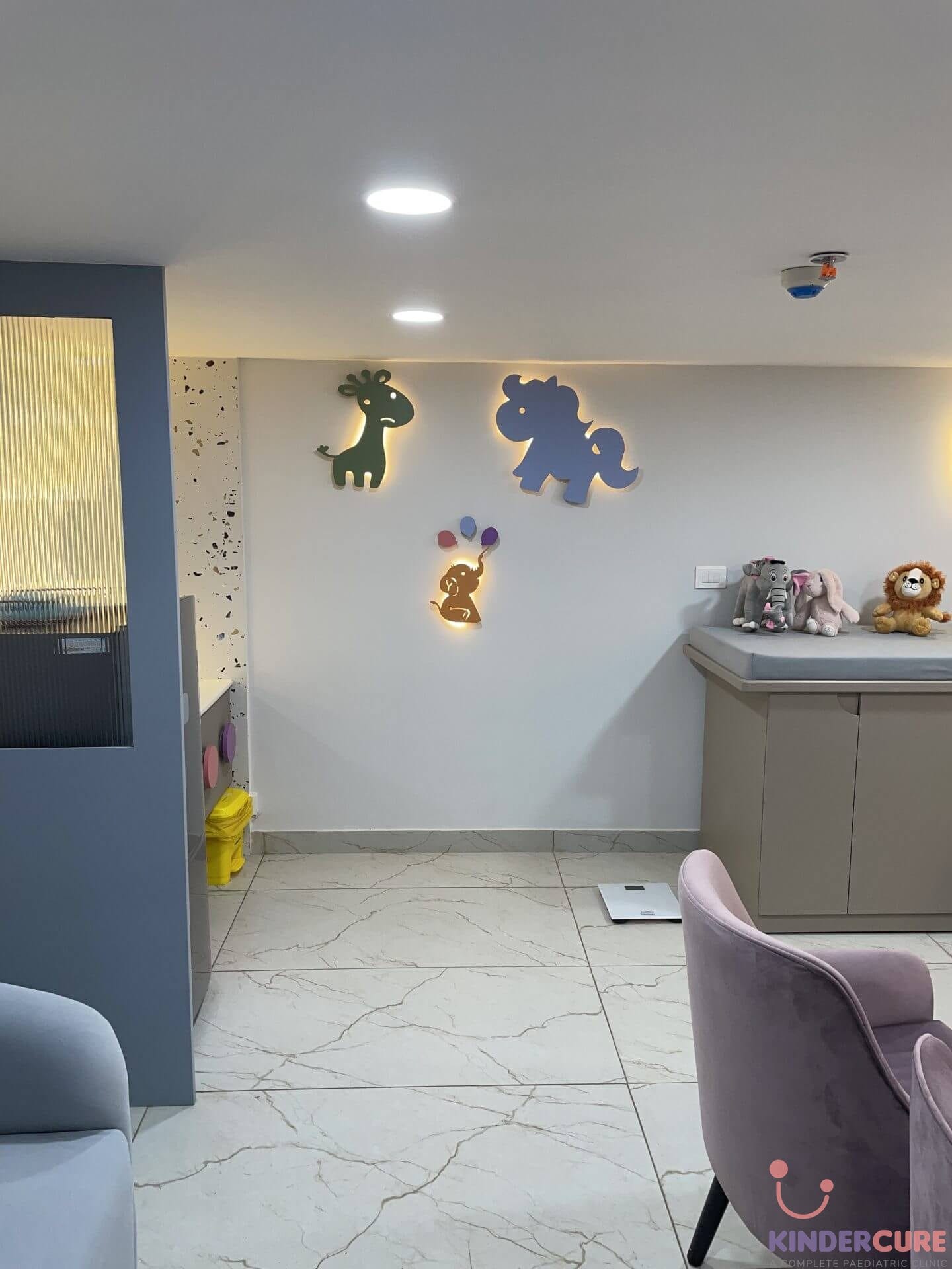 Clinic wall at KinderCure featuring cute backlit small animal figures, creating a warm and inviting atmosphere