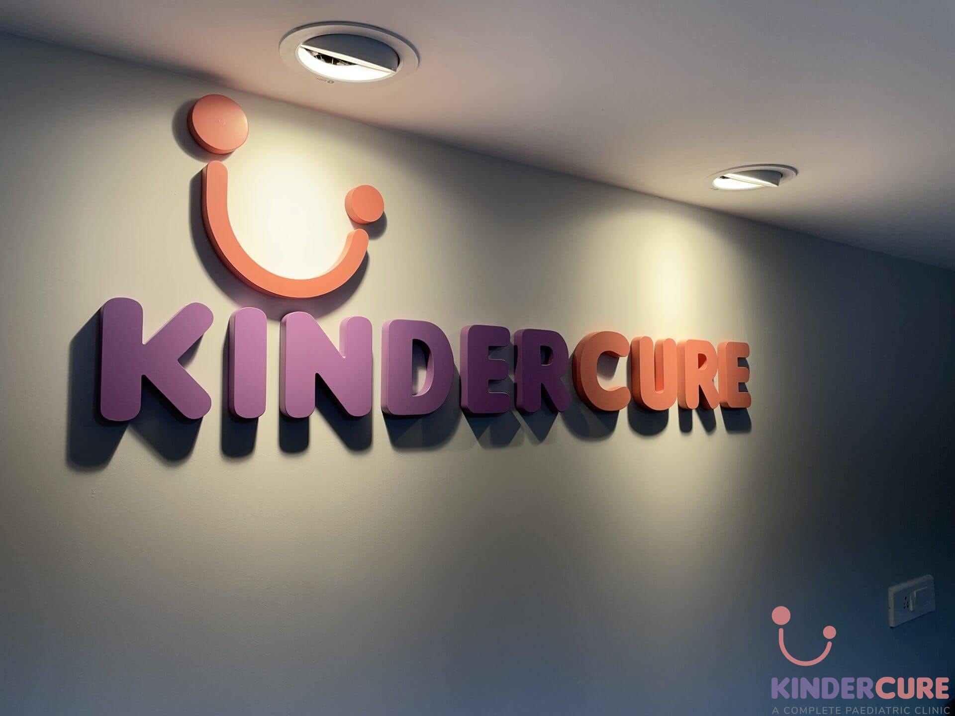 KinderCure's logo inside the paediatric consultation room with Dr. Garima Mengi in Gurgaon