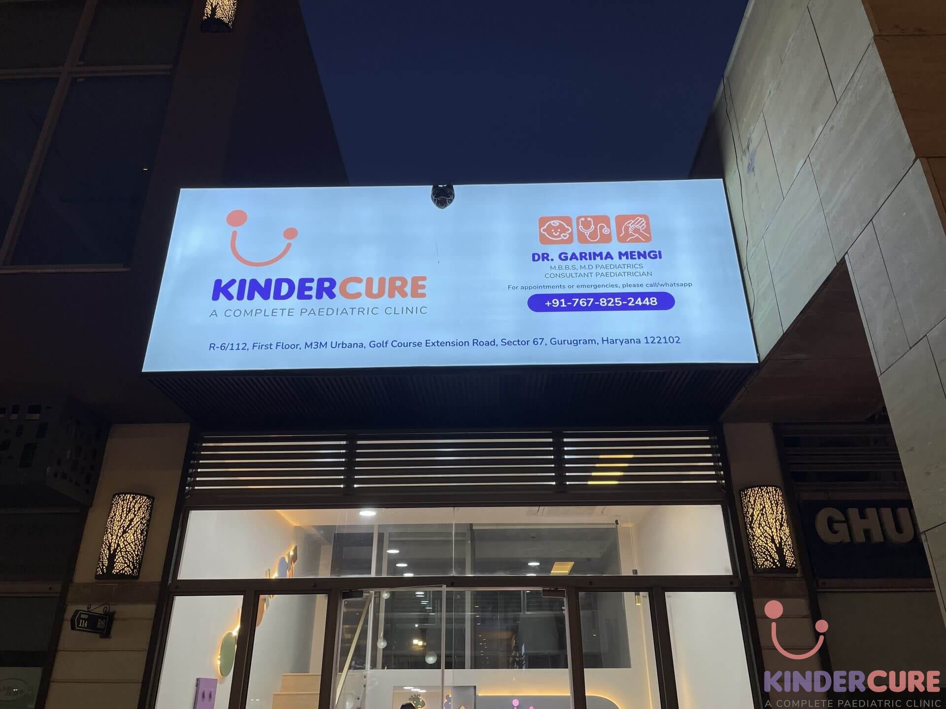 Exterior view of KinderCure Paediatric Clinic, Gurgaon, showcasing the clinic's board